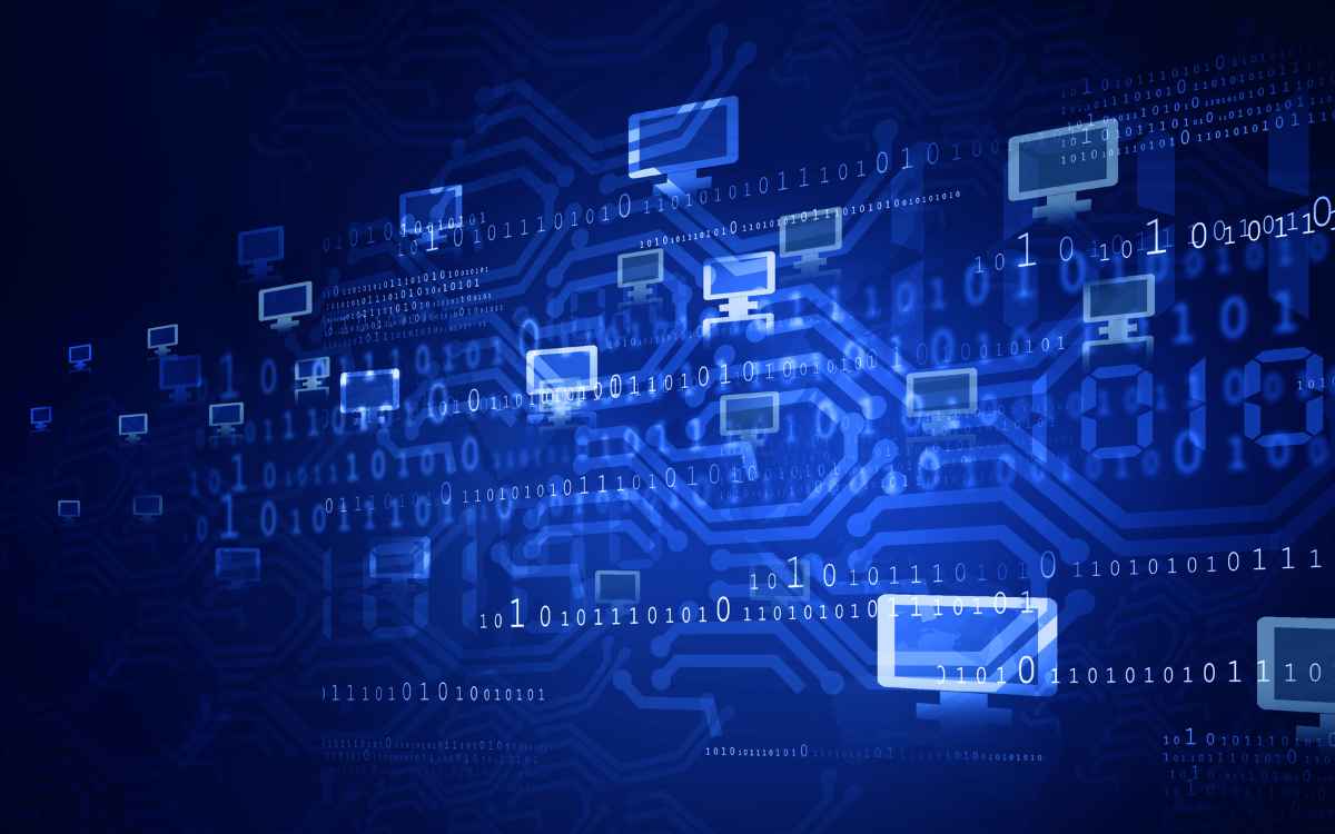 Vemos una imagen de un fondo azul con diferentes tipos de dispositivos interconectados, en relación con la implementación de una red VLAN.